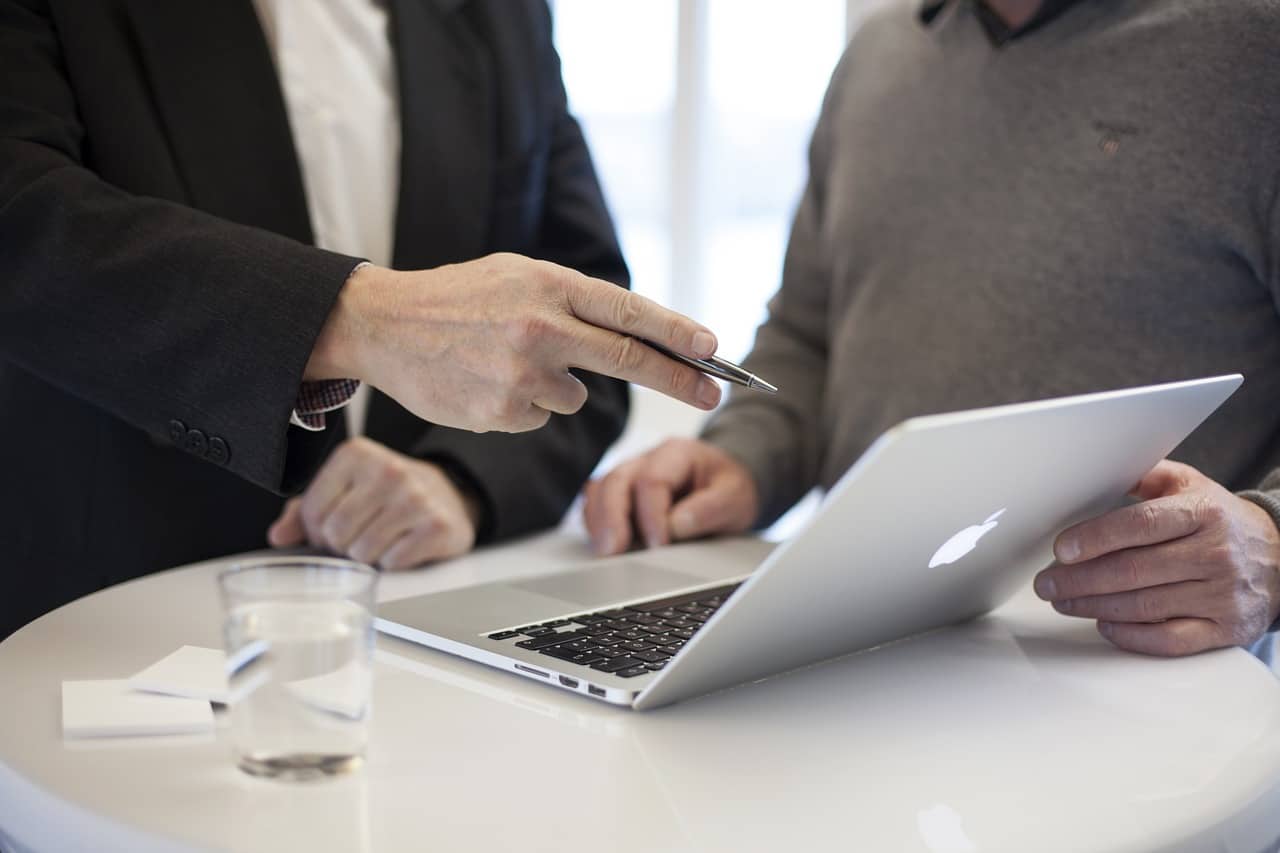 a man point finger on the laptop