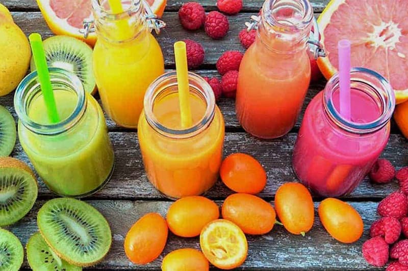 oranges, lemons, juice, avocado lies on the table