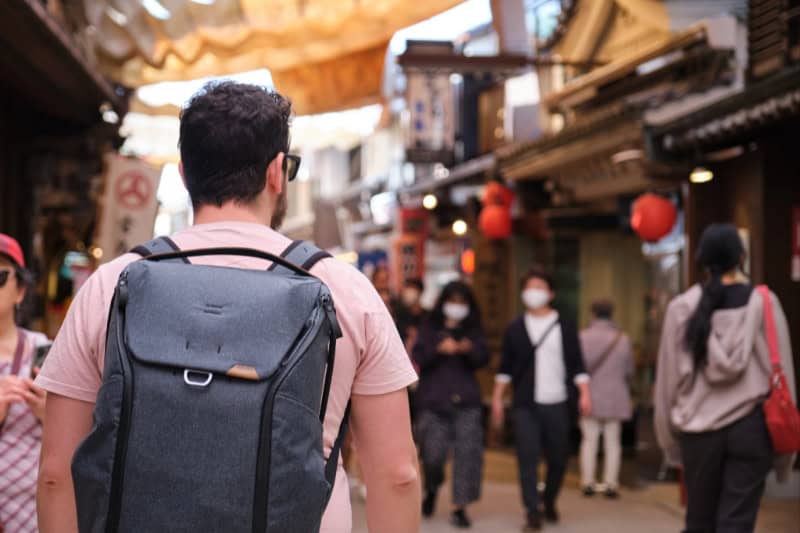 a man tourist with backpack visit Japan old city